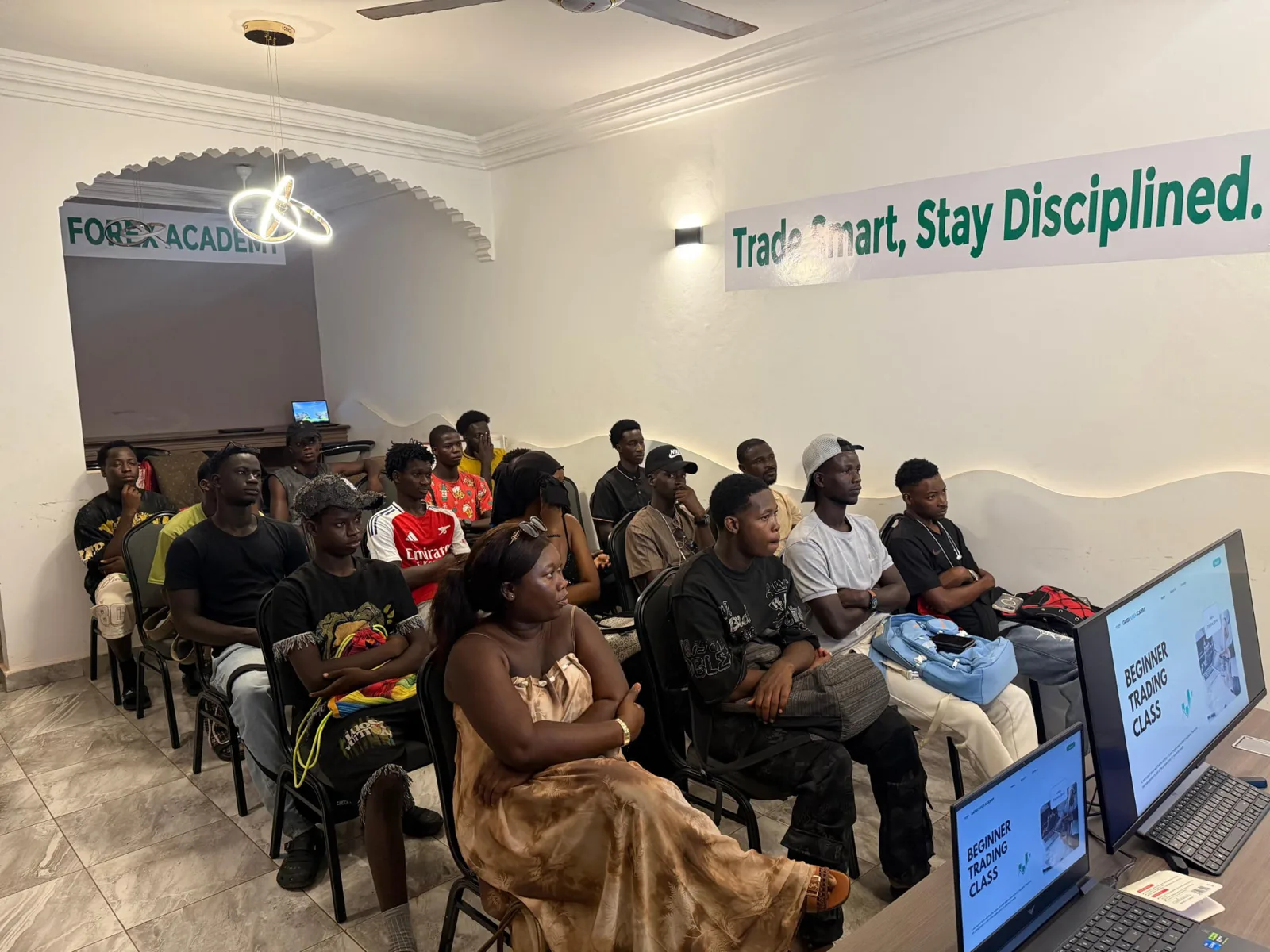 Students attending a beginner trading class at Garba Forex Academy
